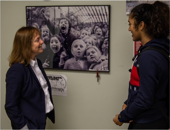 Principal and student chatting